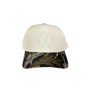 Cap with a design on the front and text on the side against a gray background
