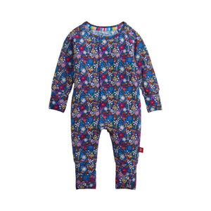 A baby long-sleeve convertible footless one-piece jumpsuit with an all-over colorful floral print on a dark blue background, shown flat against a light off-white background.