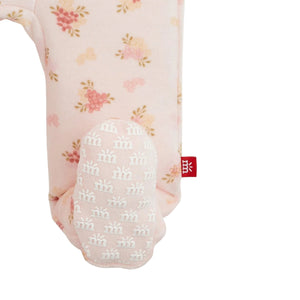floral baby footie zoomed in on bottom of the footie grippers