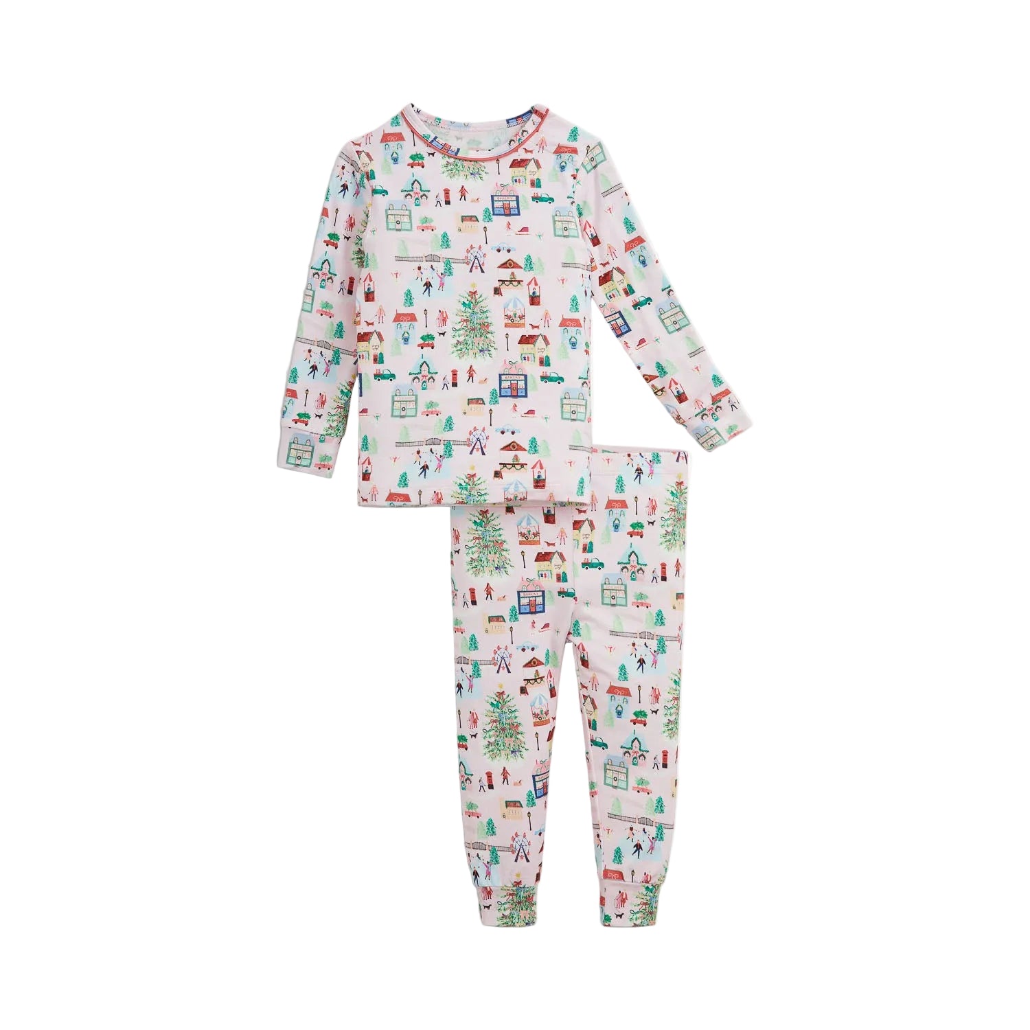 A two-piece children's pajama set featuring a long-sleeve top and matching pants with an all-over Christmas village print on a white background.